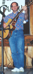 Ron Pulcer playing acoustic Bass Guitar